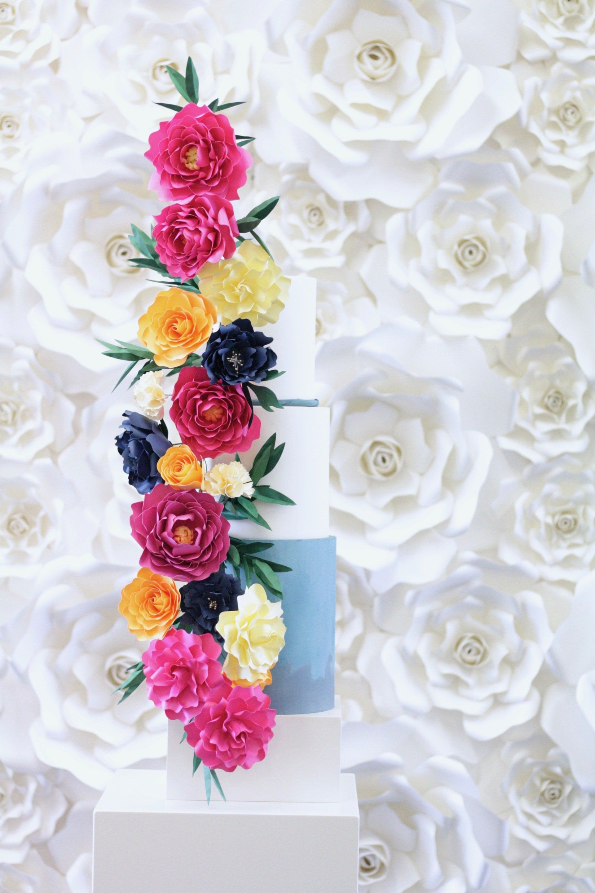 Bright paper flower wedding cake