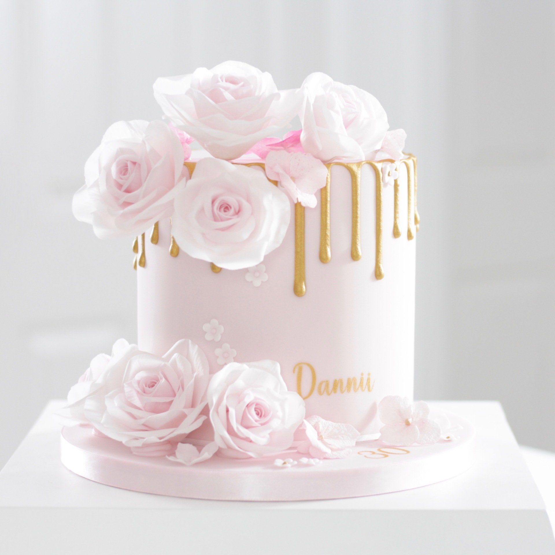Pink sugar flower drip birthday cake