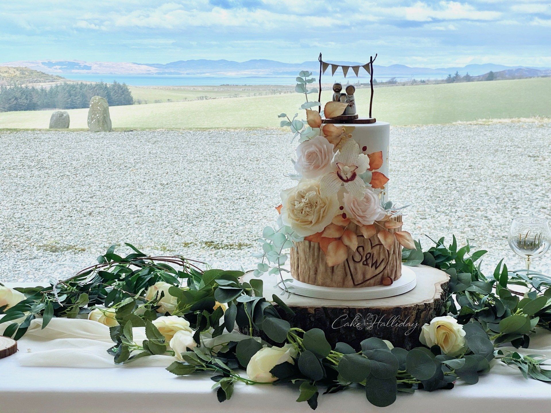 Log tier sugar flower wedding cake