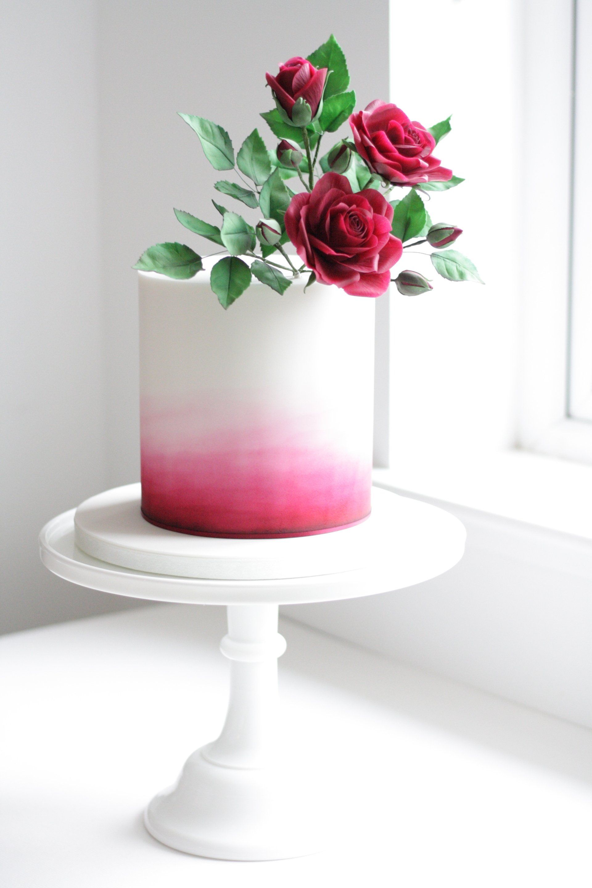 Burgundy red sugar rose watercolour wedding cake
