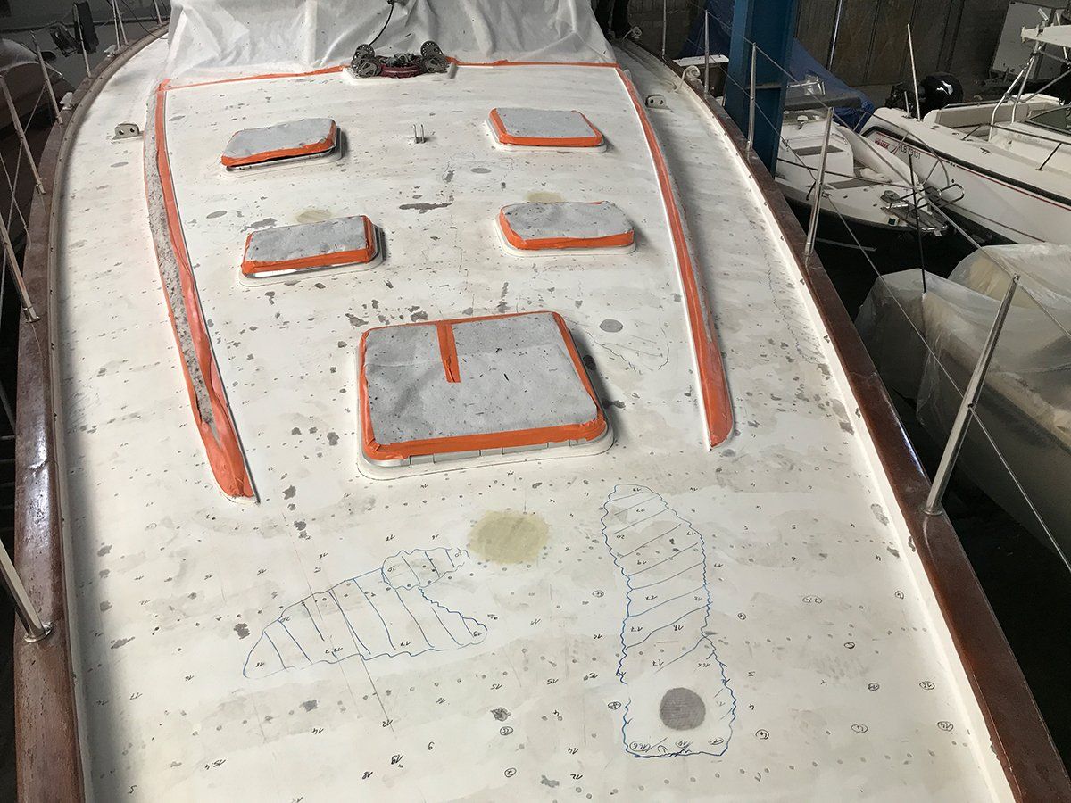 Moisture measurement on a Farr 60. The yacht deck must be prepared before the installation of the new teak deck by Mobilerbootsbau teak decking company