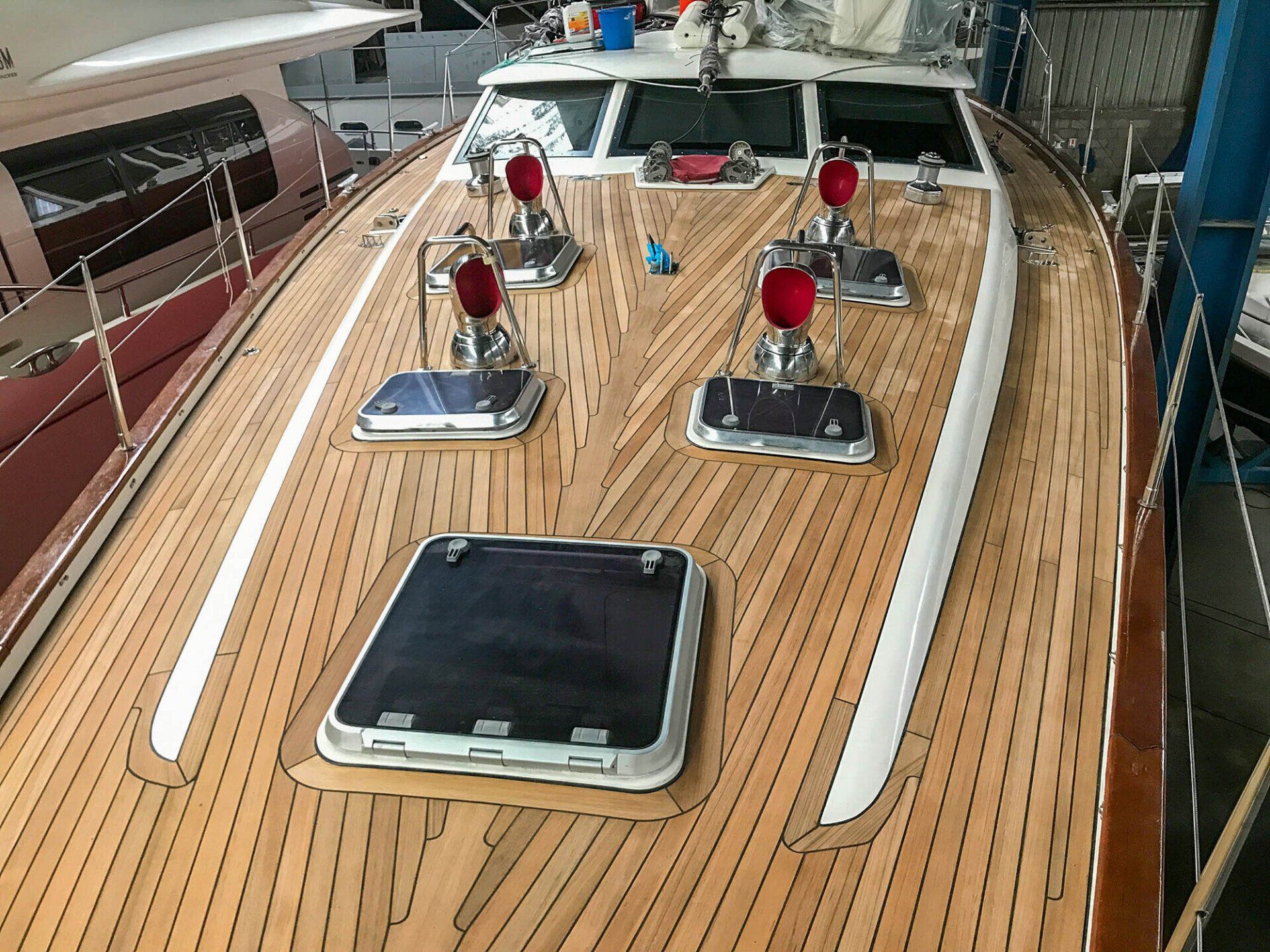 New vacuum-bonded teak deck on 60 ft sailing yacht Farr 60
