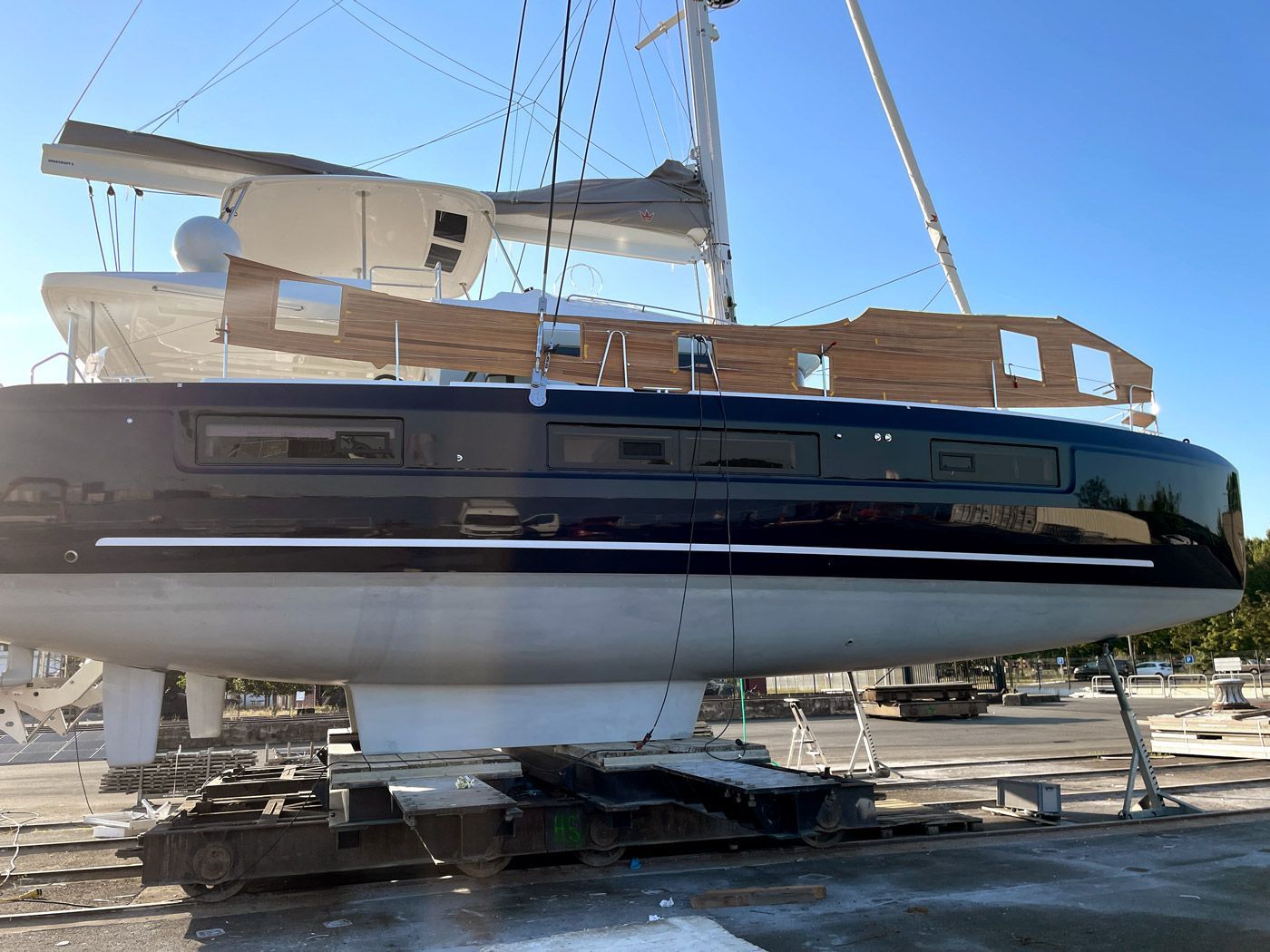Teak deck installation on the Lagoon 51: teak deck is delivered in pre-caulked panels Teak deck installation on a Lagoon 51 catamaran: teak deck panels are delivered pre-caulked and with a built-in moisture barrier