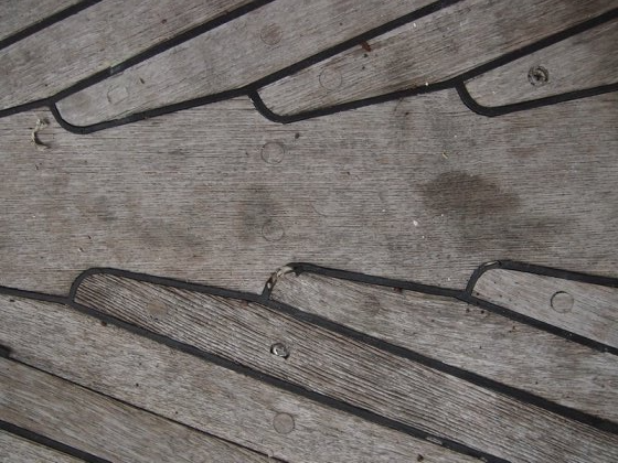 Najad 320 old teak deck with damage before the installation of a new teak deck