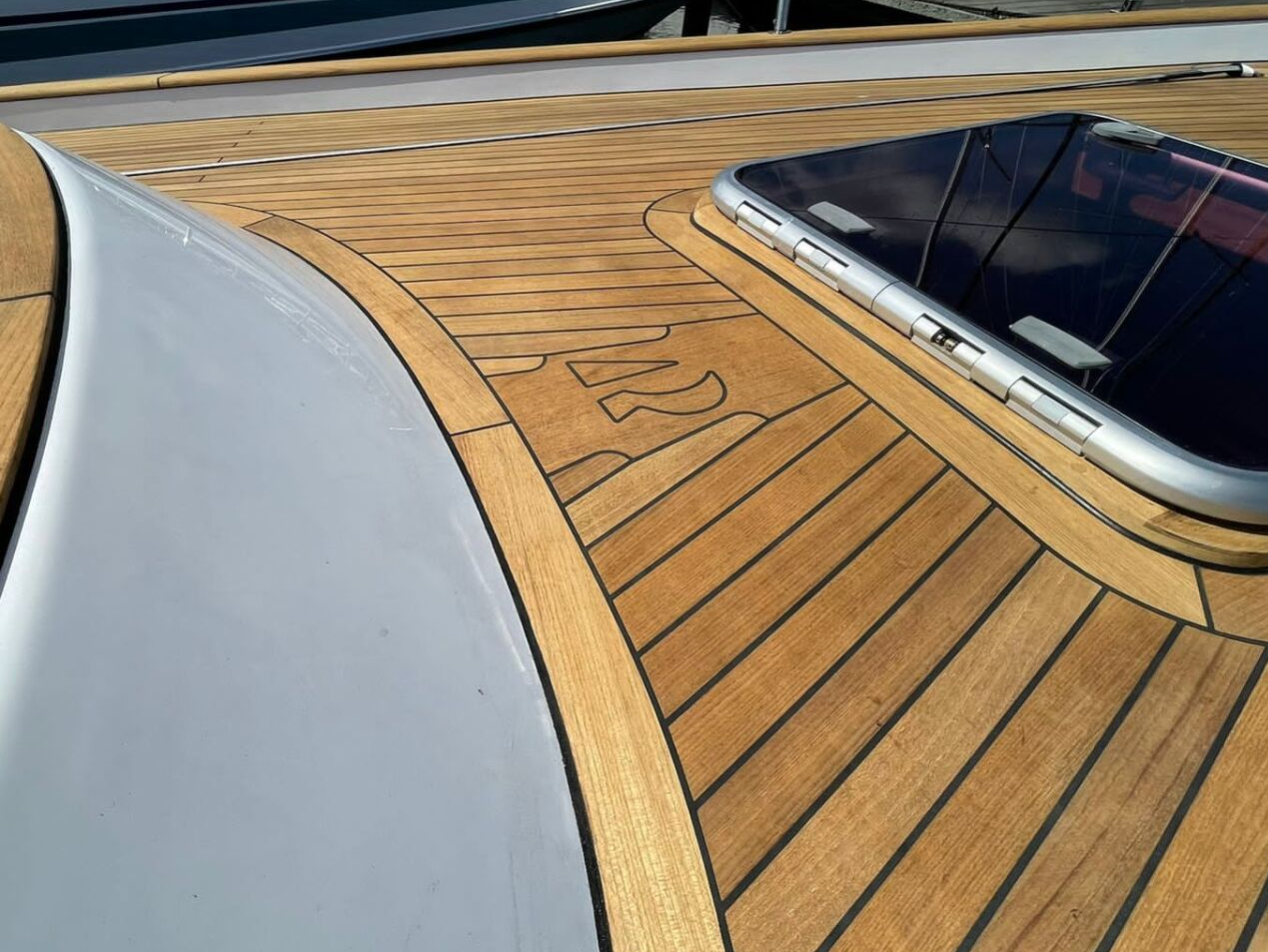 New teak deck for a Hallberg-Rassy 46 with inset lettering | Mobilerbootsbau teak decking
