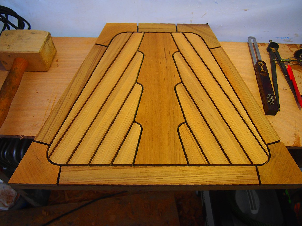 New teak deck with elegant layout on anchor locker on a Seafin 410 sailing yacht, construction and installation by Mobilerbootsbau teak decking