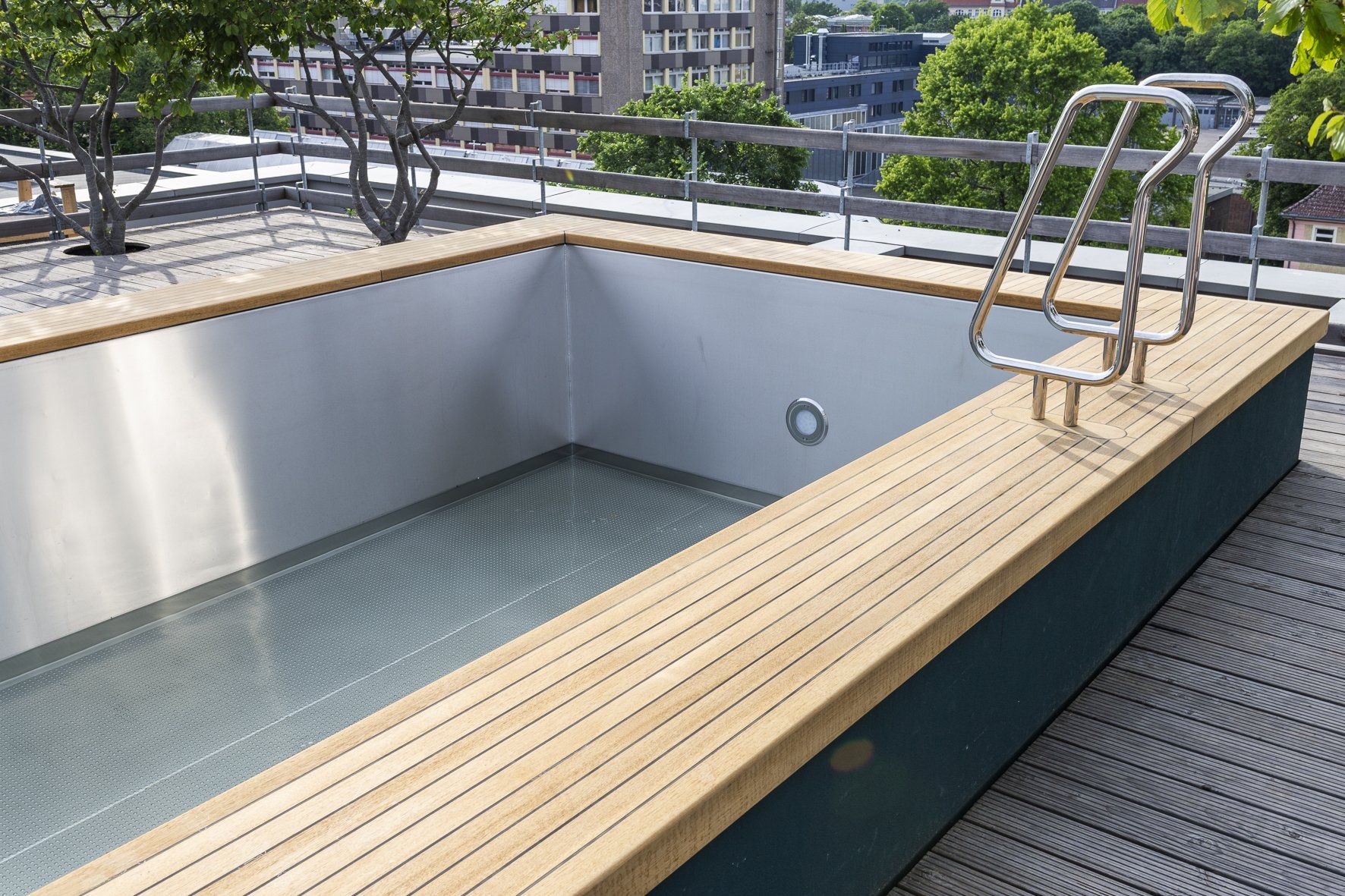 Teak decking and pool border with teak steps and pathway