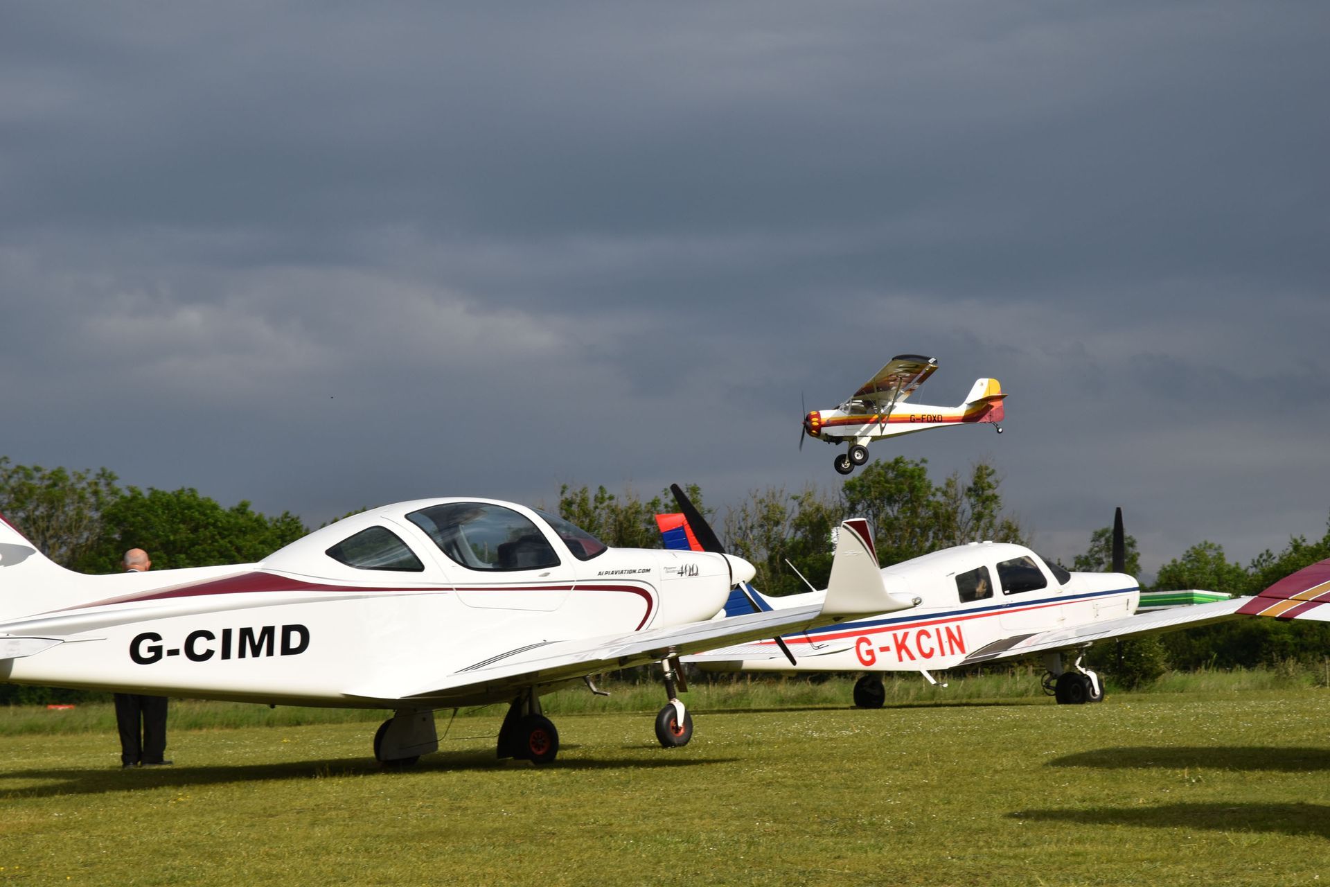 Dark clouds overhead with aircraft in the foreground