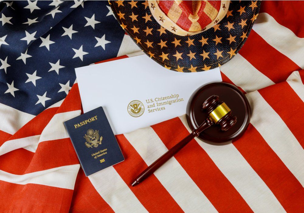 a gavel on an American flag and passport