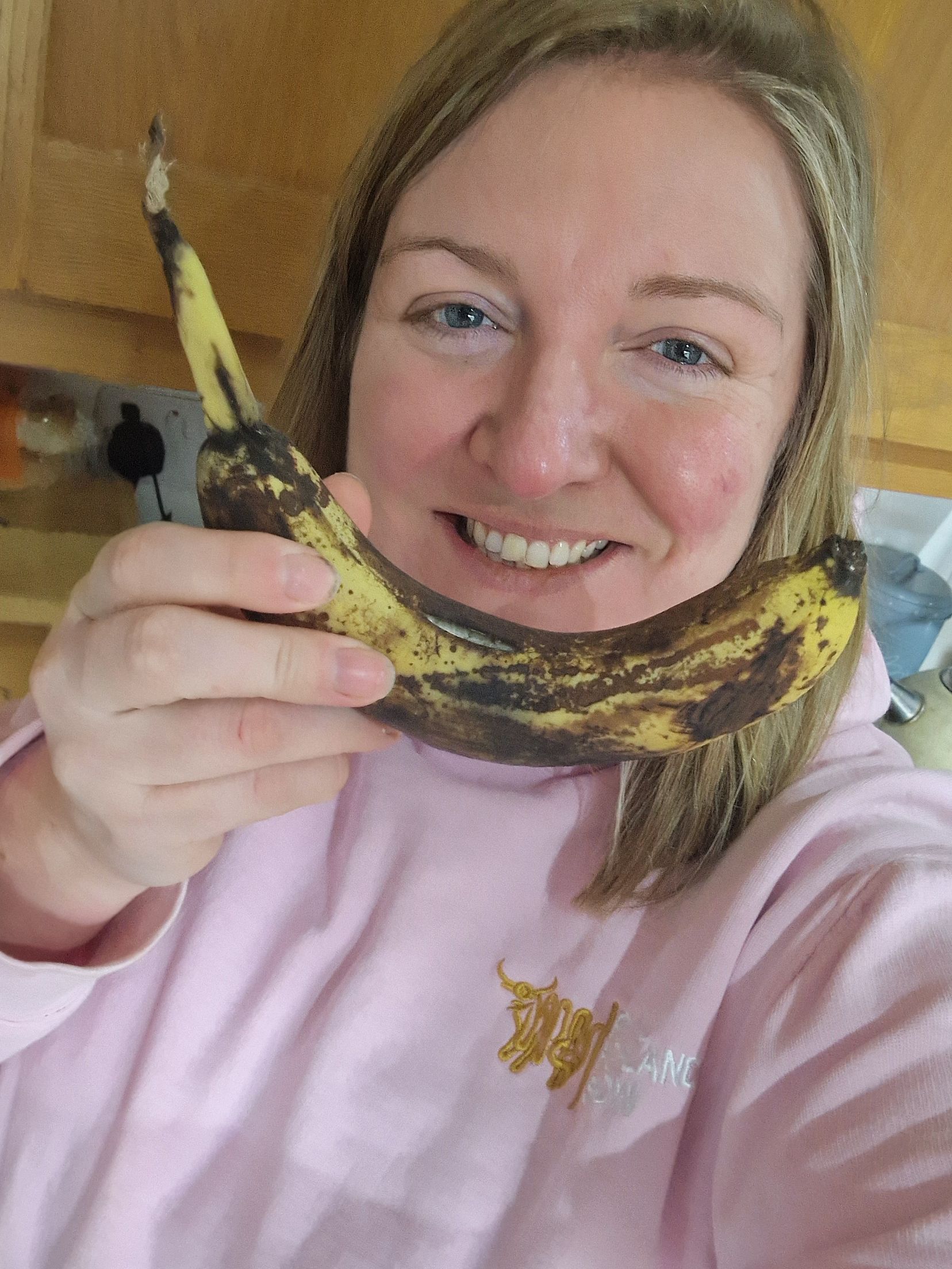Milly Fyfe holding up a banana