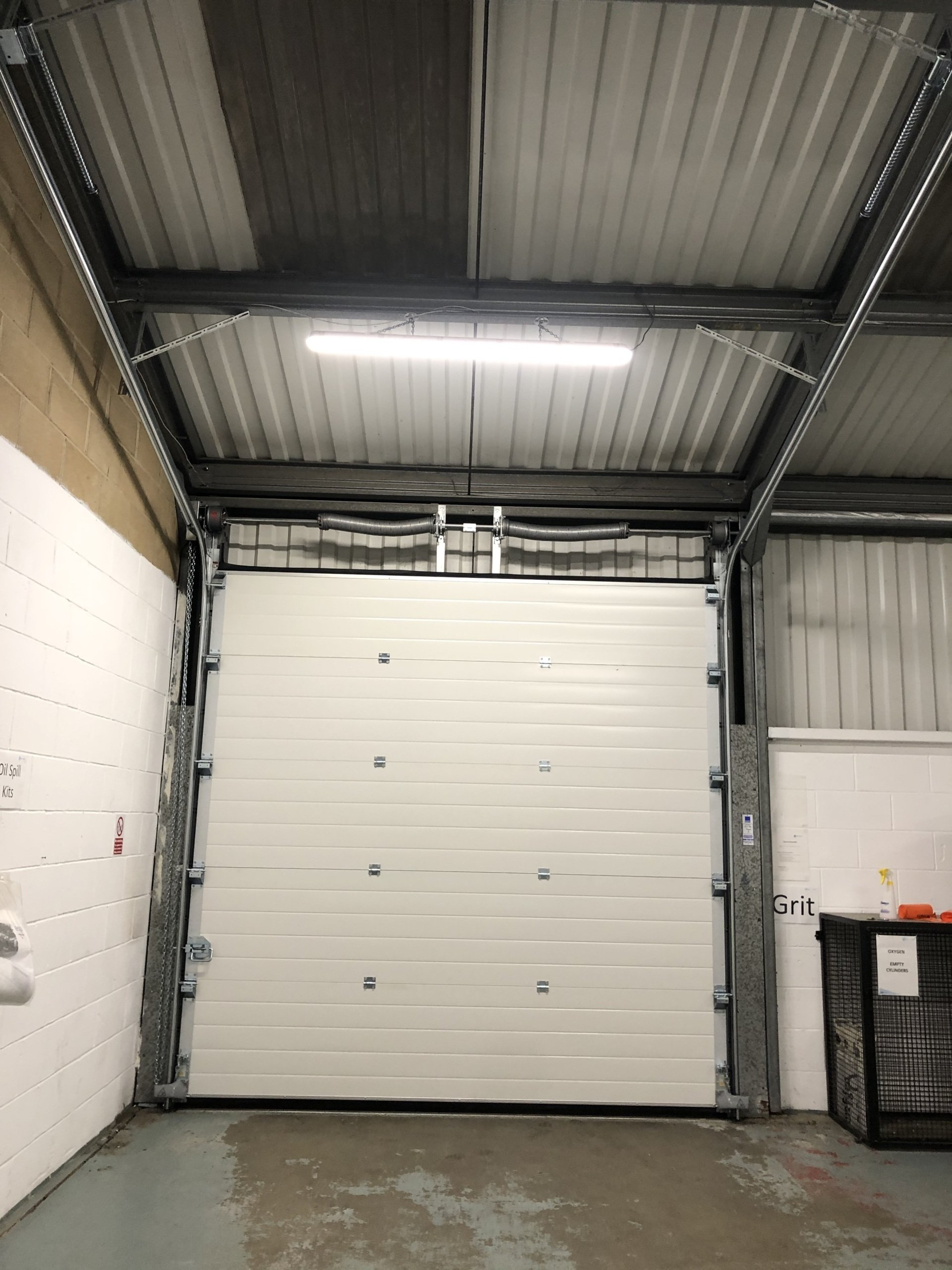 Internal white sectional overhead door inside warehouse unit