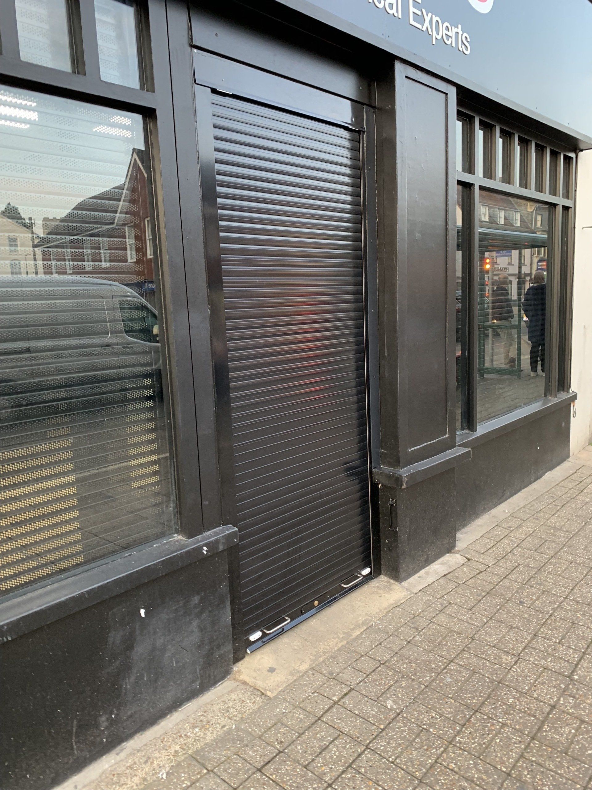 Grey roller shutter door fitted on an industrial unit