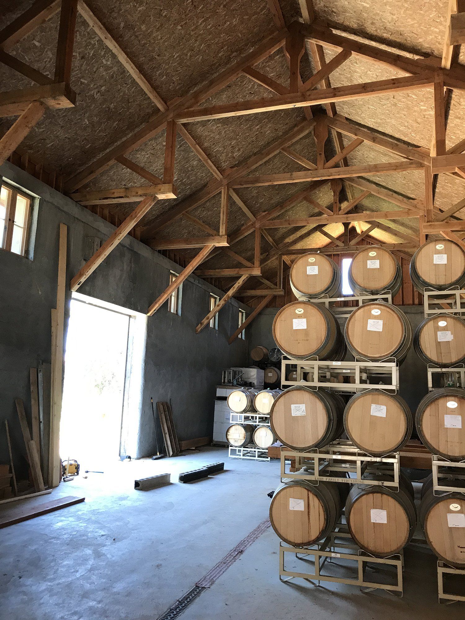 detail of timber trusses inside the roof of a new building