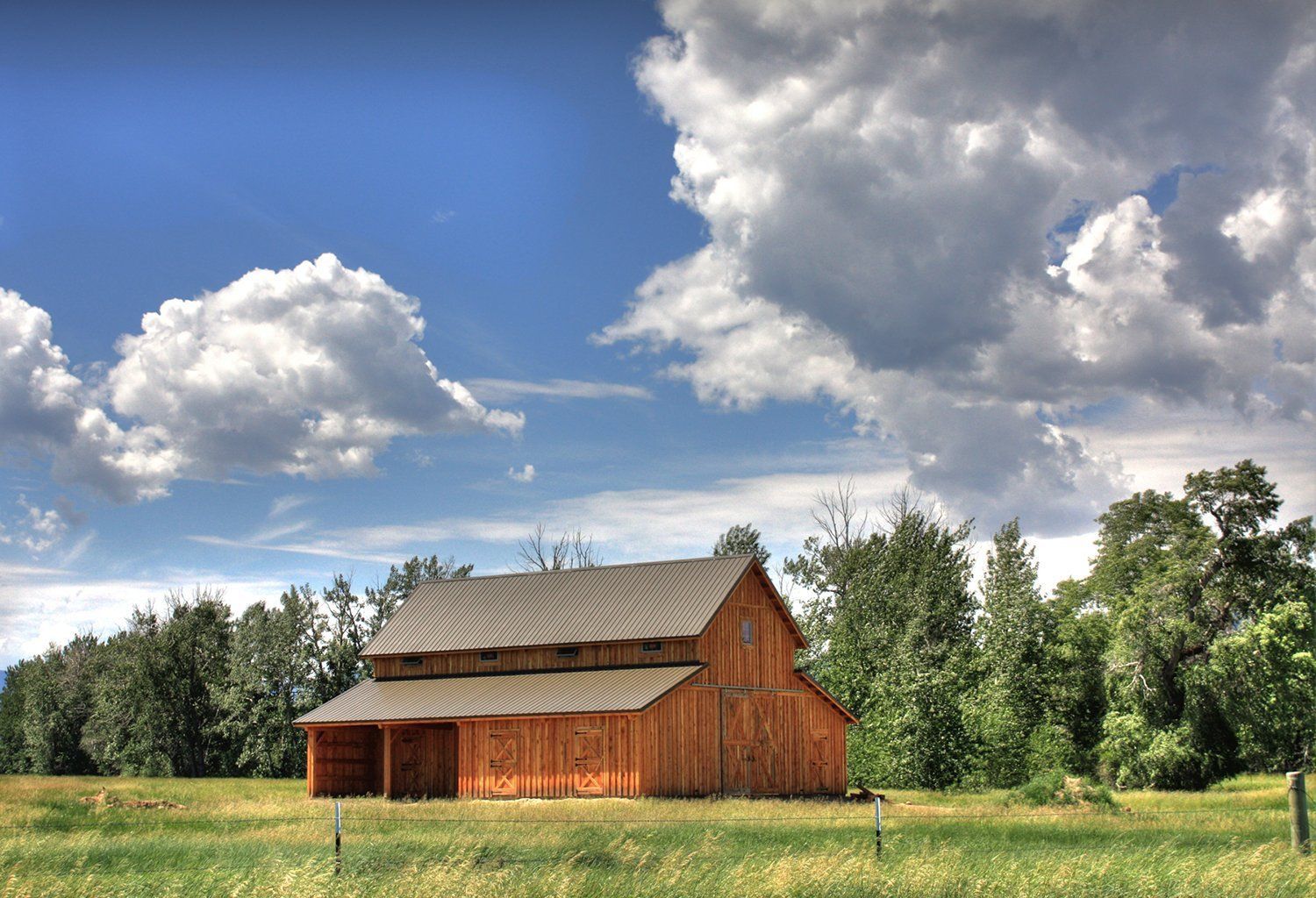 new a-frame style home with clouds in the background