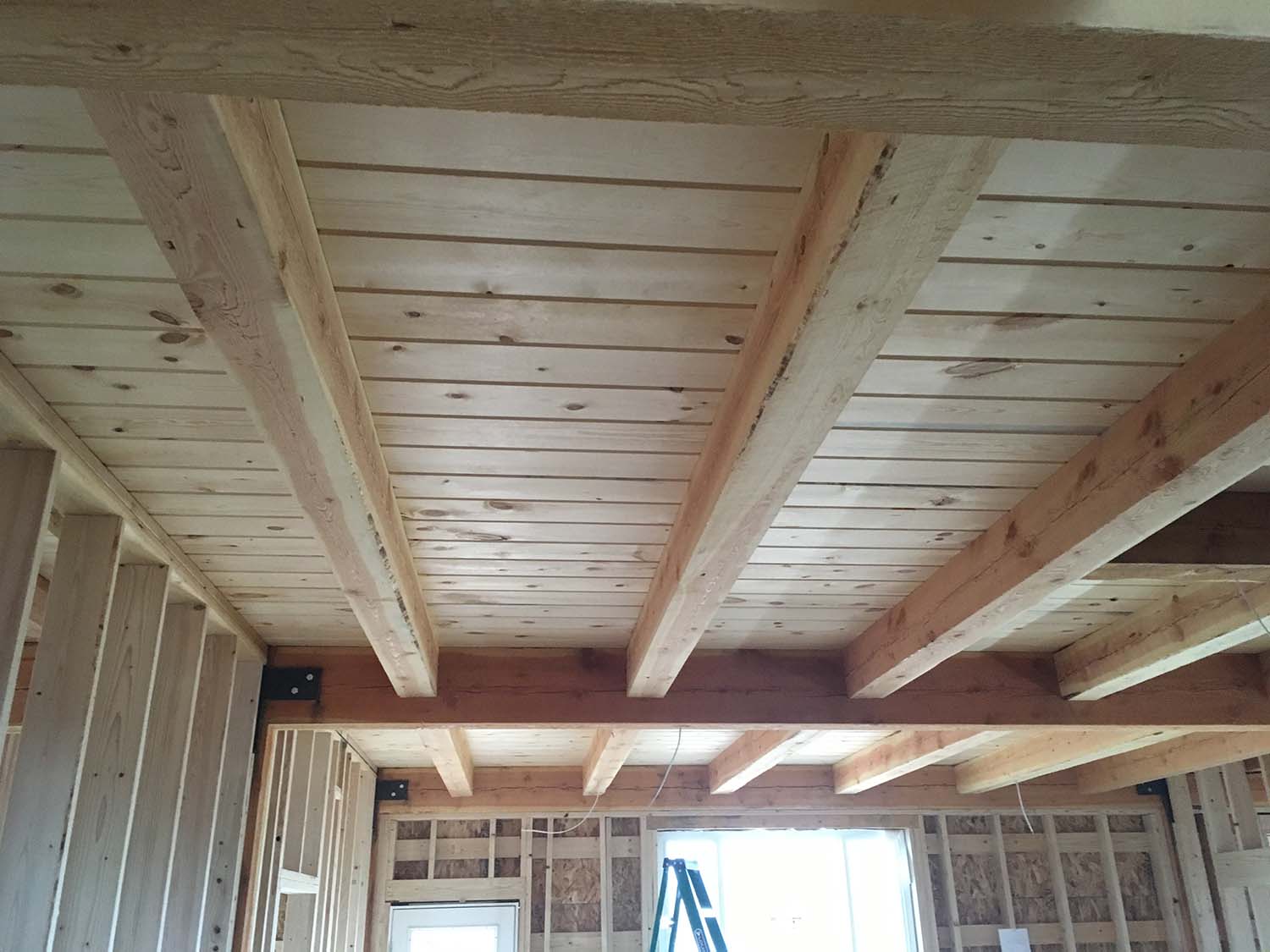 wooden beams lining the ceiling of new construction