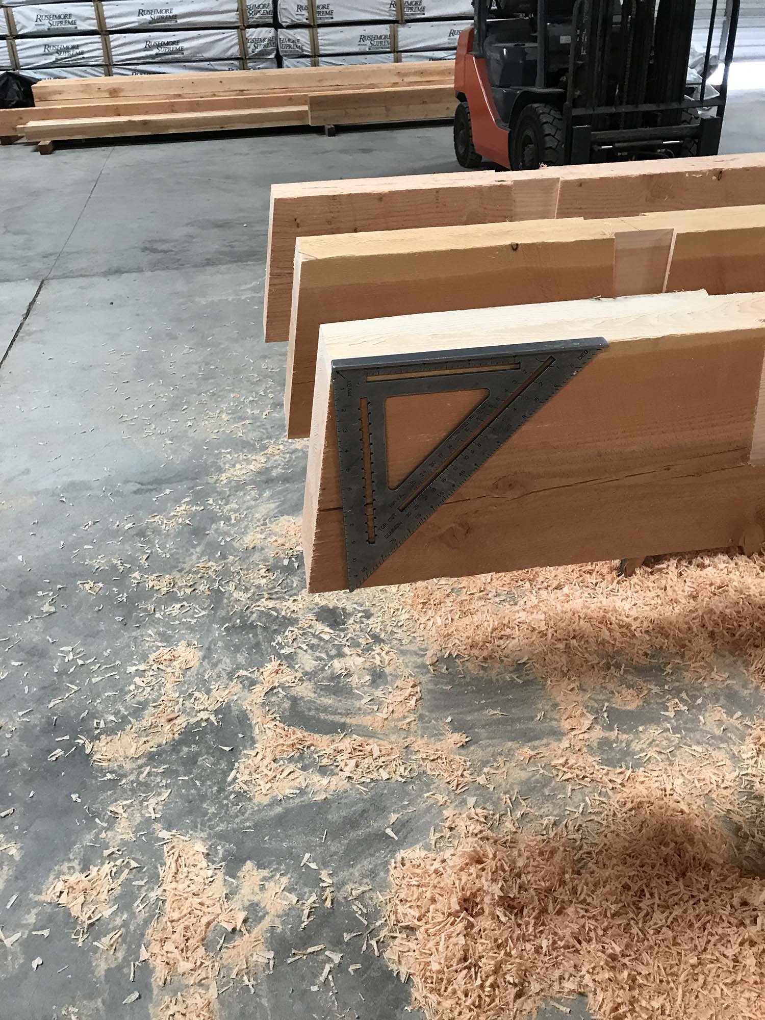 beams stacked next to each other in warehouse