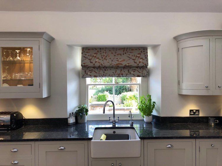 Harlequin fabric roman blind