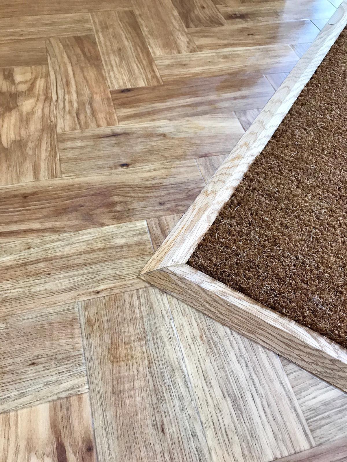 Amtico Luxury Vinyl Tile flooring with entrance mat