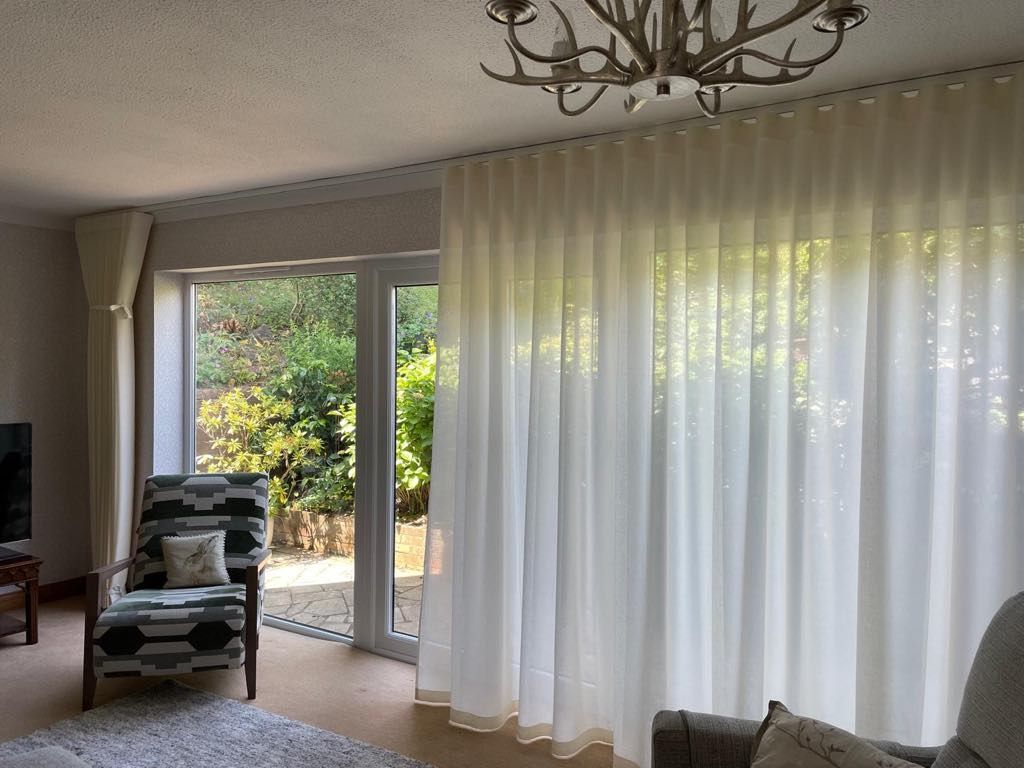 Prestigious Textiles voile fabric wave heading curtains on a Cameron Fuller track