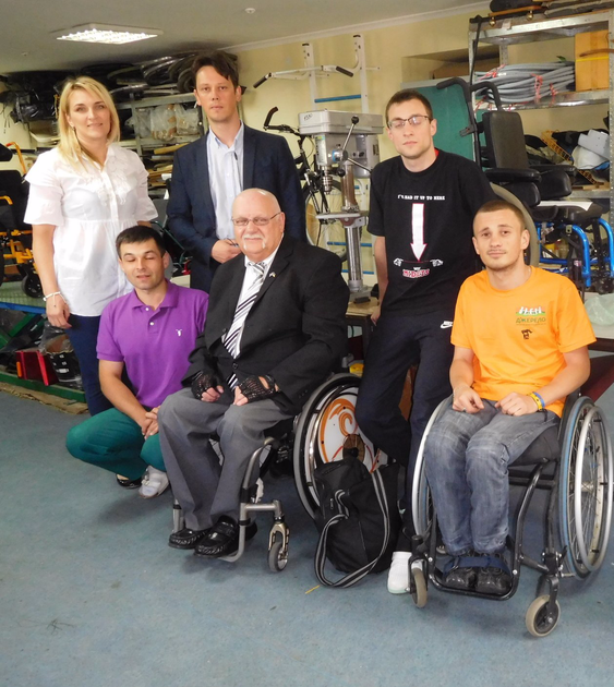 Convener and Keith with group of disabled and Carers in Wheelchair Workshop in Dzherelo Centre, Lviv, Ukraine