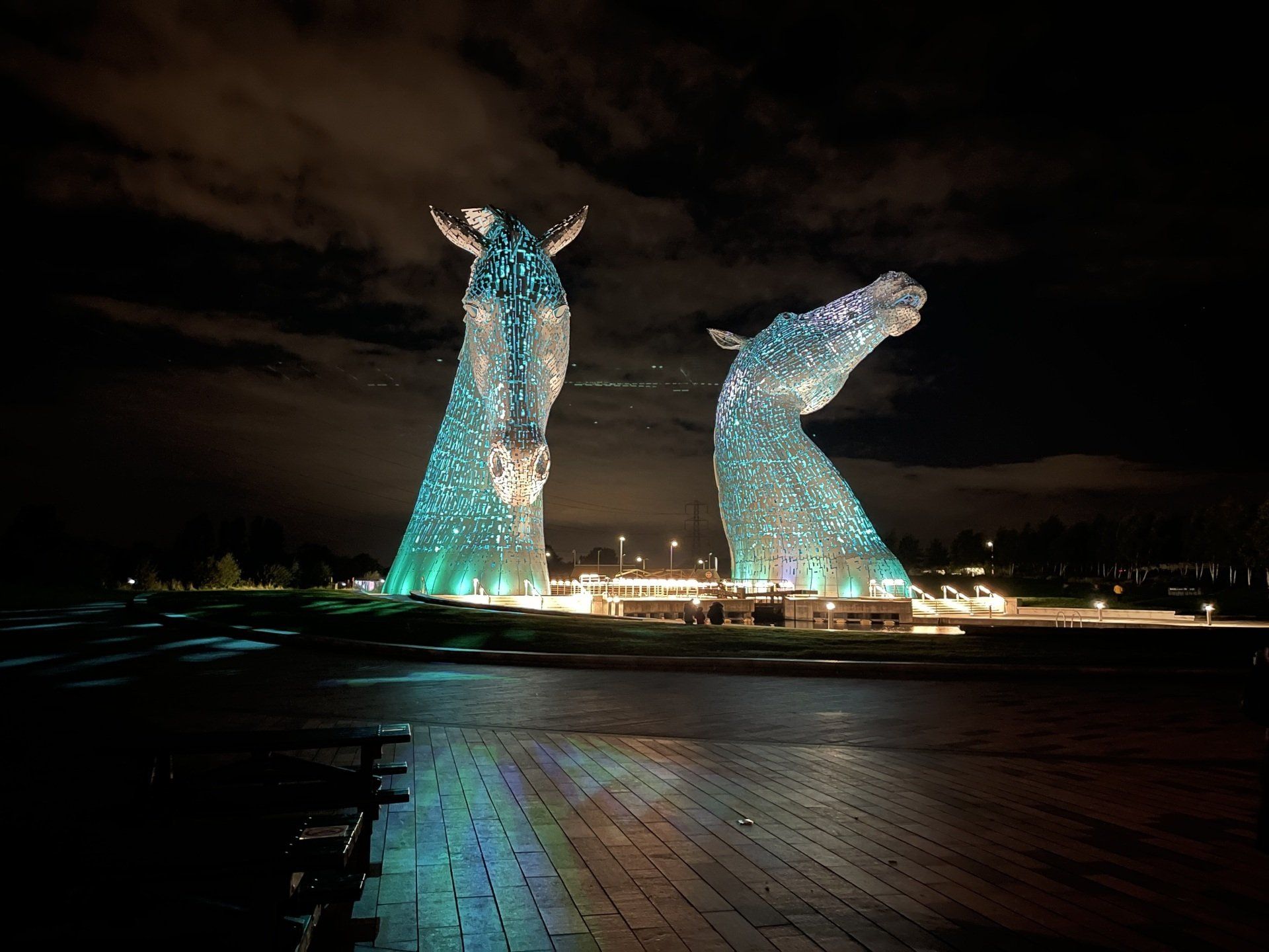 The Kelpies pictured at night while light up blue