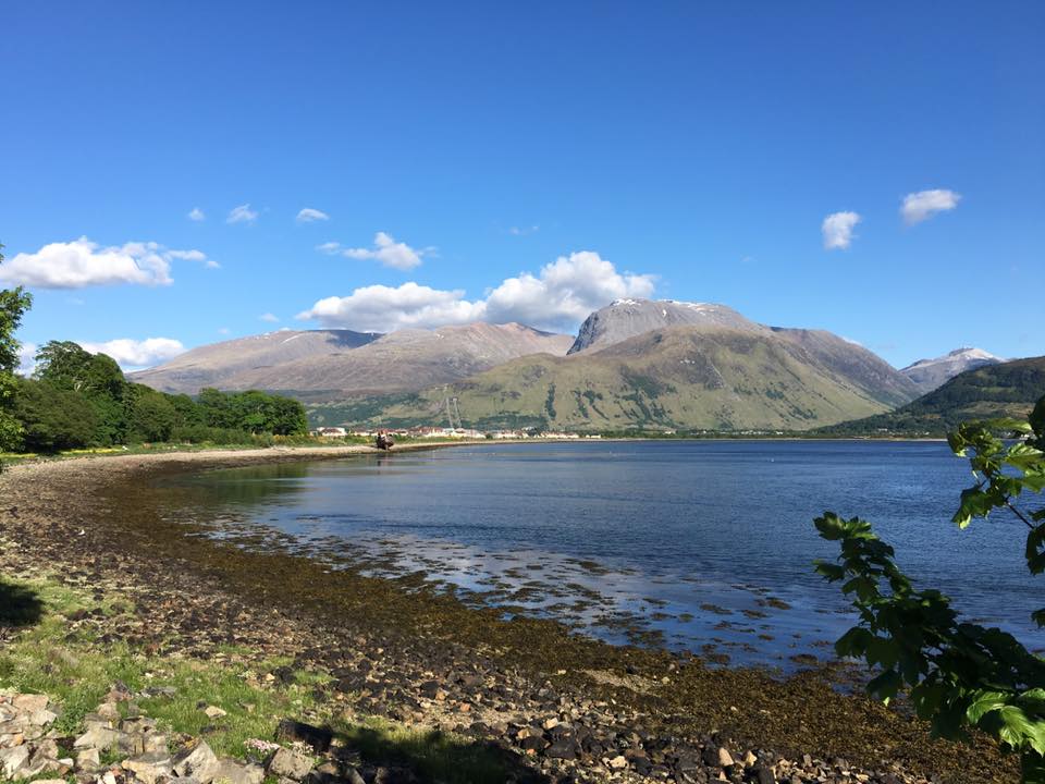 Ben Nevis pictured from the water showwcasing the mountains great stature, pictured on a sunny private day tour