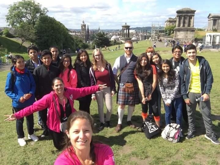 Josh with another student group showing them Edinburgh from the top of Calton Hill