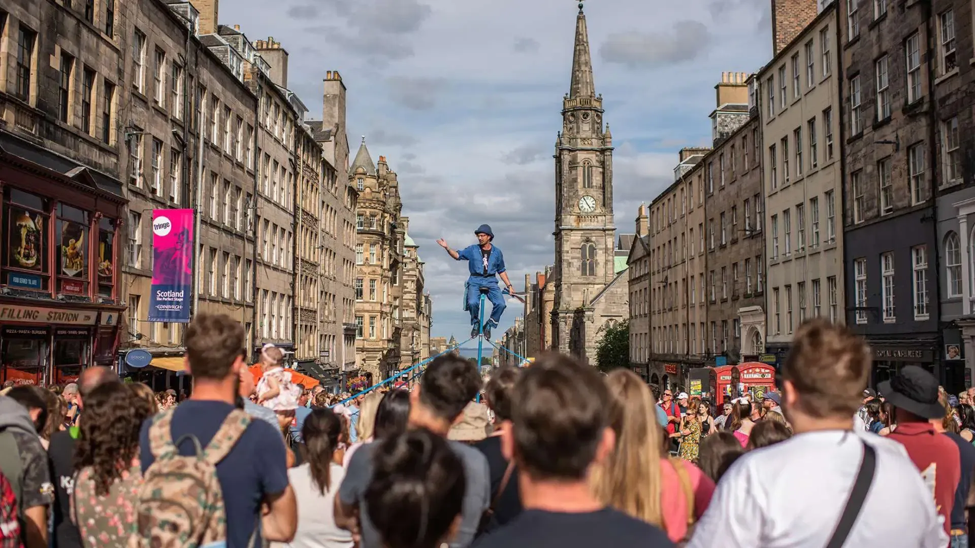An Edinburgh street performer towering above the crowd on Edinburgh's Royal Mile