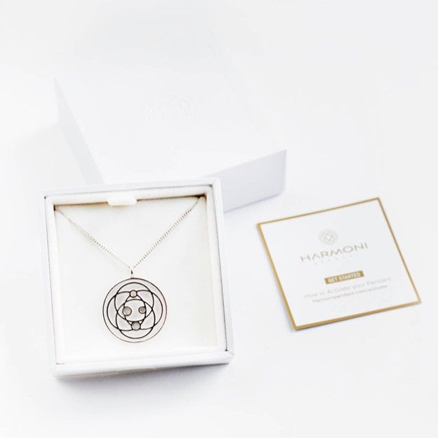Photo of the Harmoni EMF pendant in a gift box.