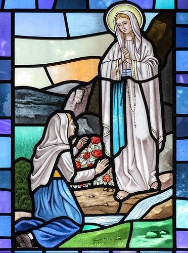 Stained glass image of Our Lady of Lourdes