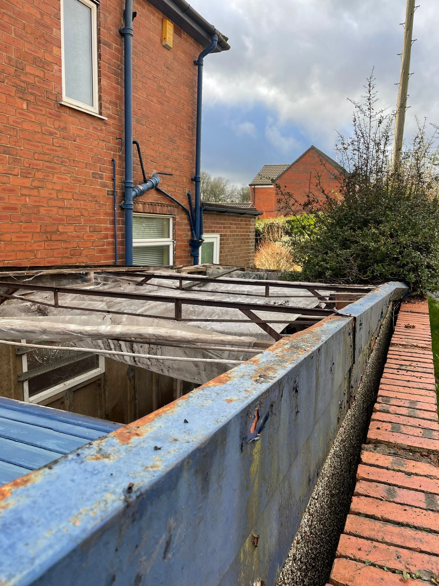 photo showing the asbestos from the garage roof has now been taken off