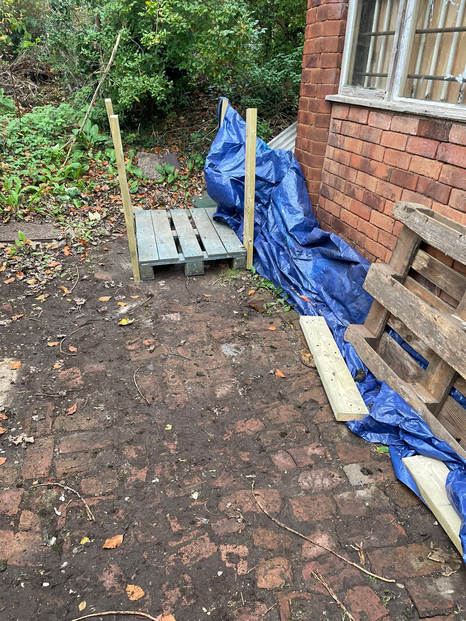 photo showing the asbestos has been taken away and the blue plastic still in place