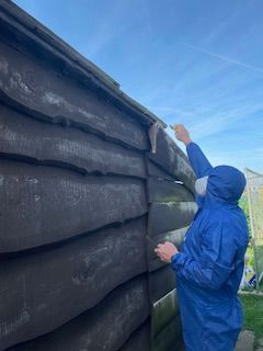 a man inspecting an asbestos garage roof in nottingham