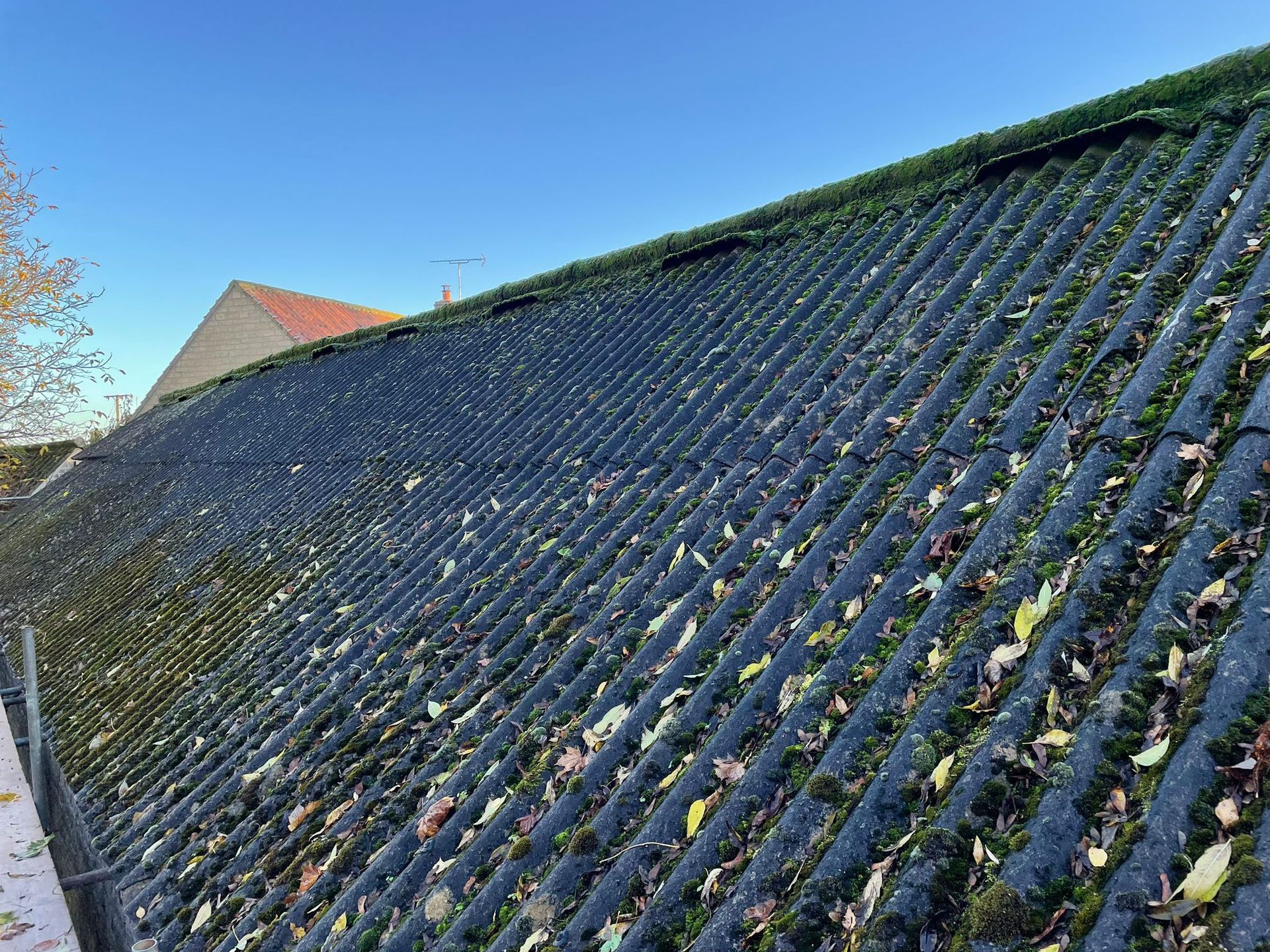 Asbestos garage roofing removed with care at a Derby domestic property.