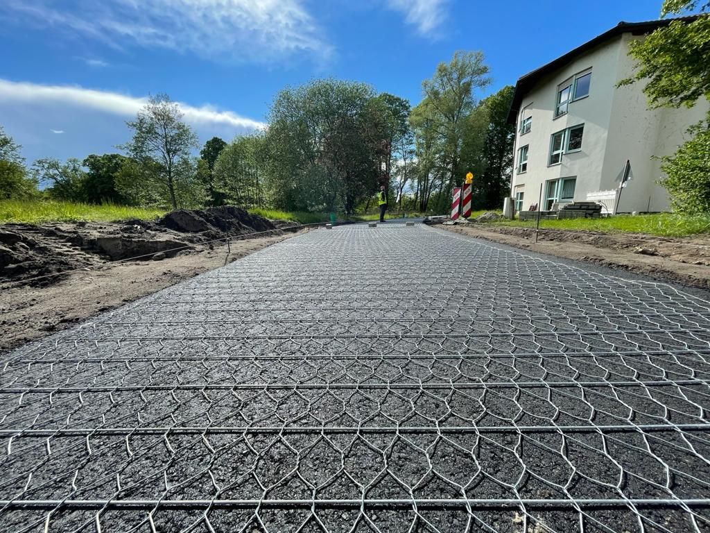 Asphaltarmierung, Roadmesh, Asphaltverstärkung, Geogitter, Straßenbau, Straßensanierung, Asphaltstabilisierung, Asphaltbelag