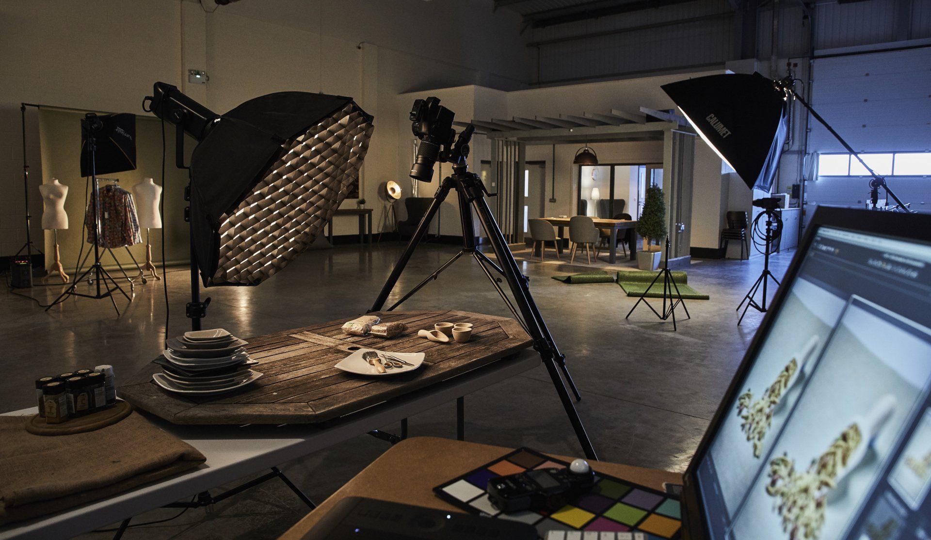 Lighting setup and camera on tripod aimed downwards for product photography