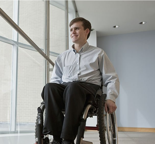 Smiling man in wheelchair looking forward