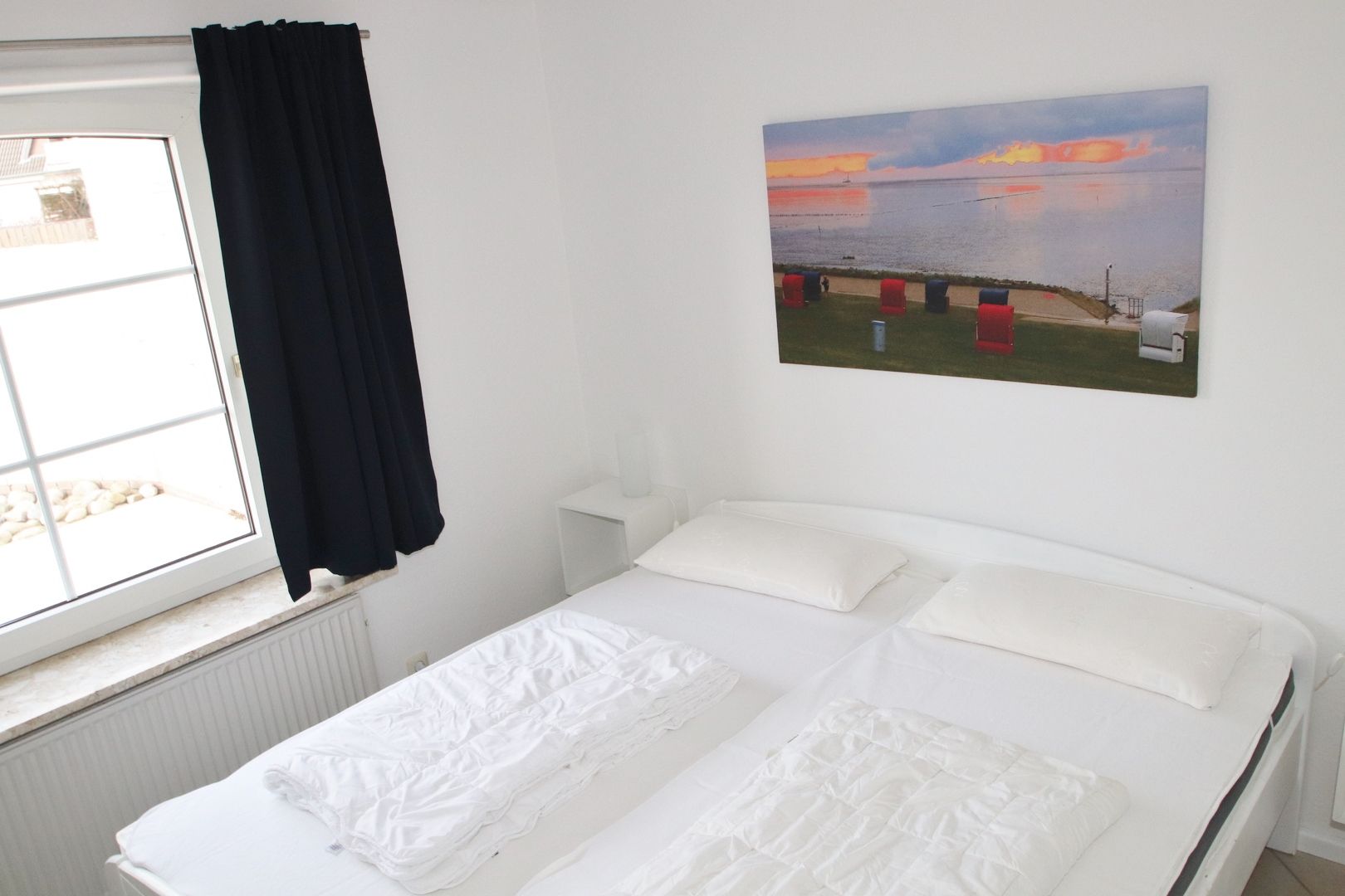 Schlafraum mit Doppelbett Erdgeschoss Ferienhaus Große Balje 5 Friedrichskoog Nordsee