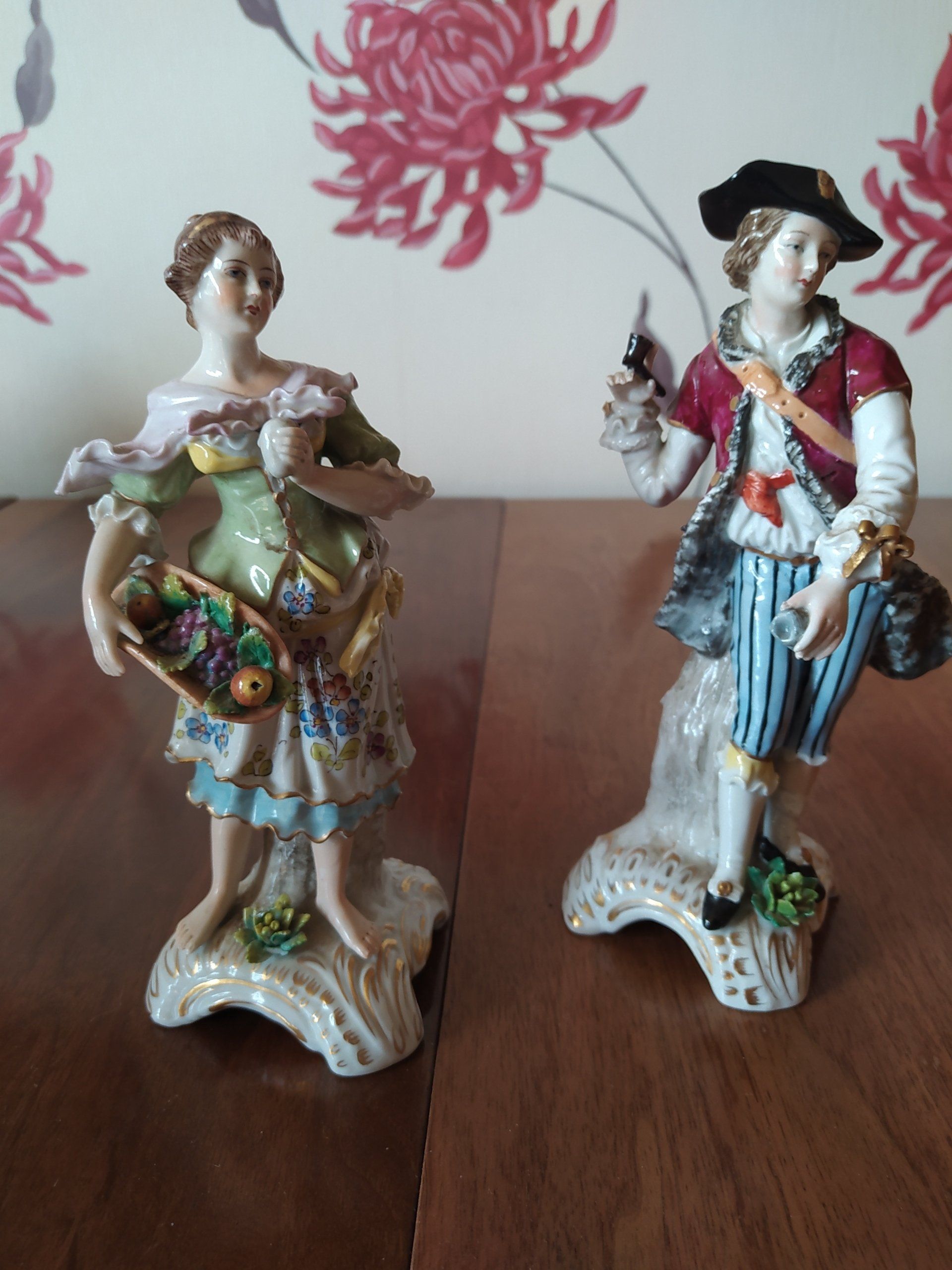 Antique Naples figures of a boy and girl.