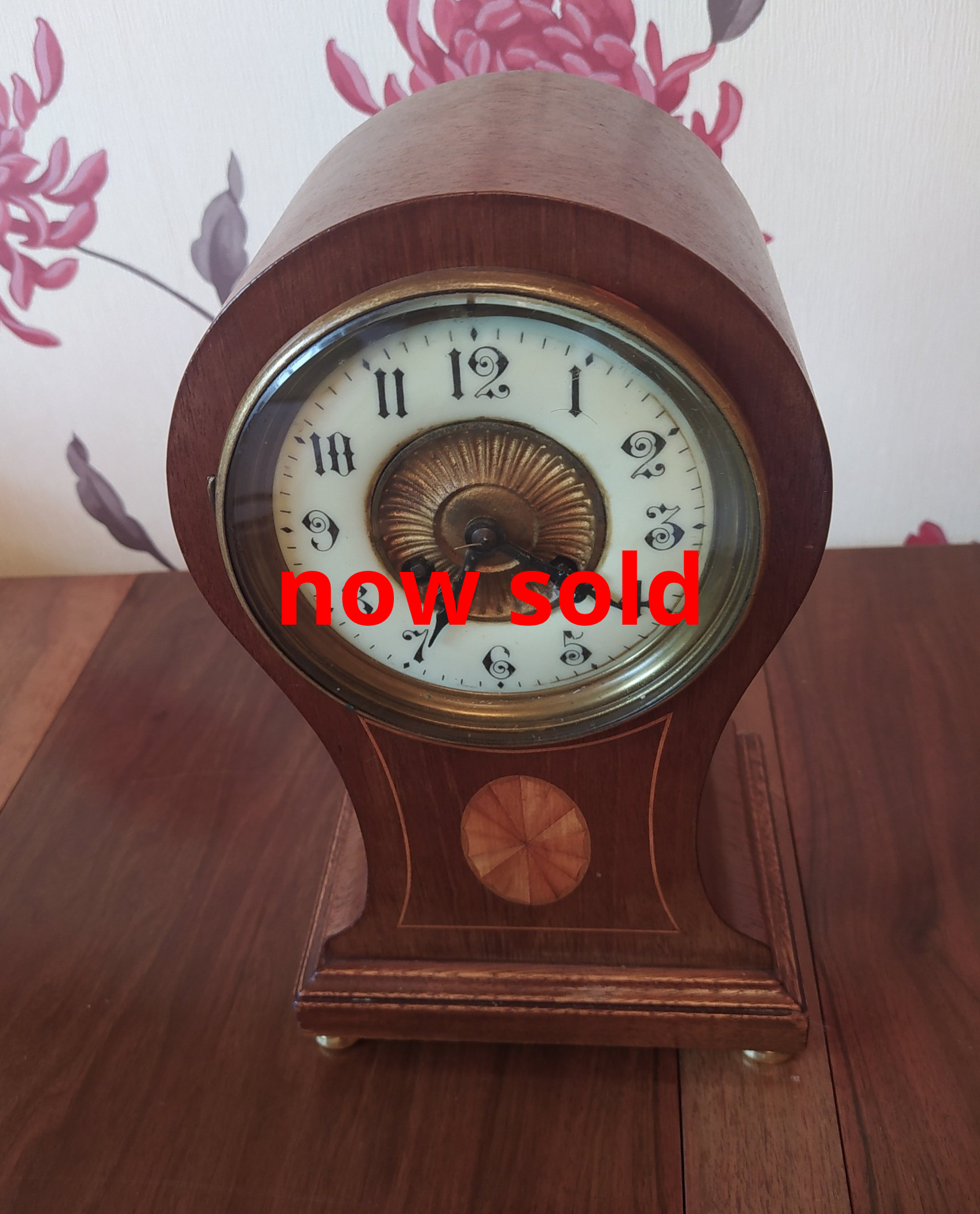 Inlaid mahogany balloon clock.