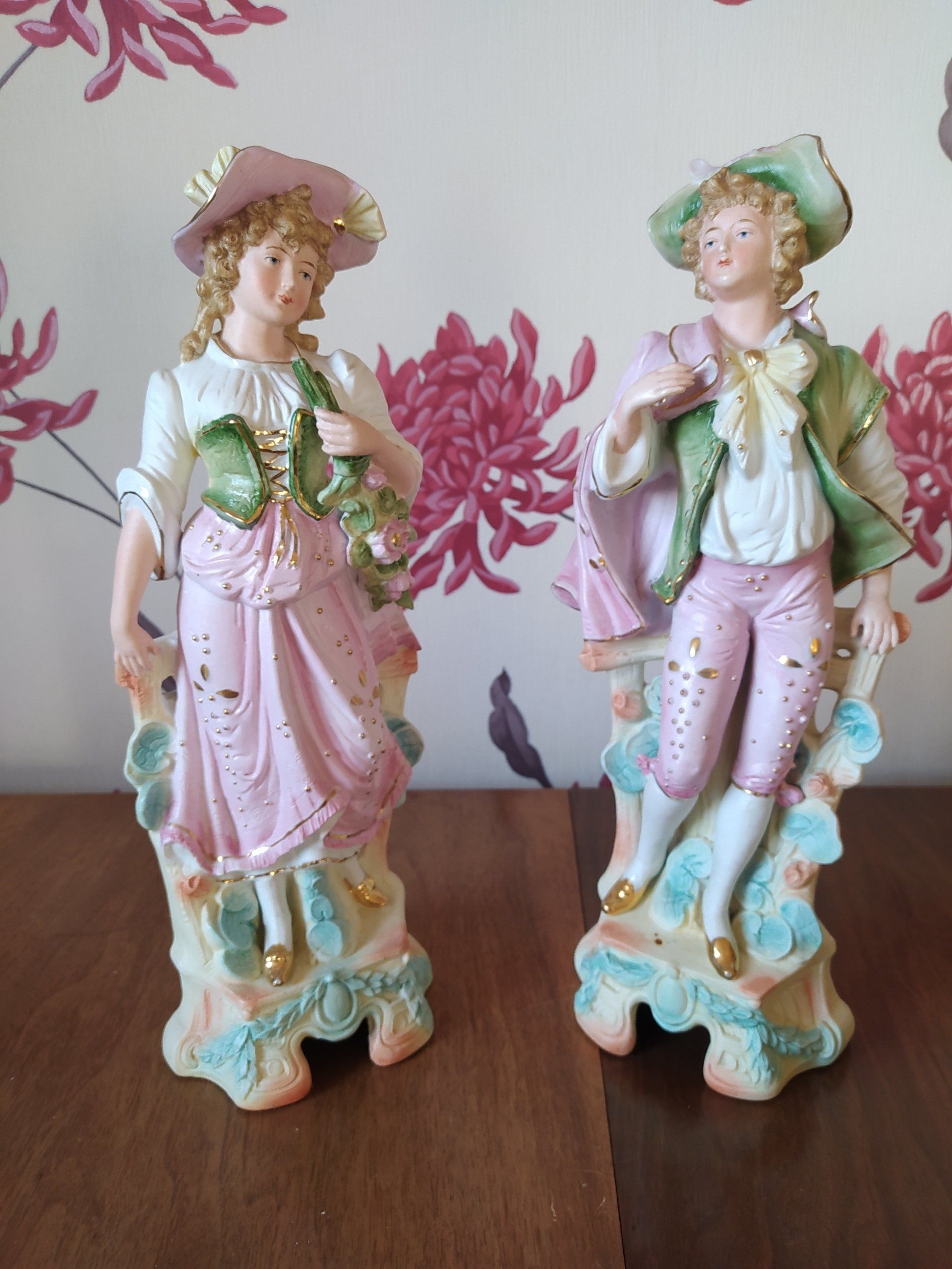 a pair of continental bisque figures of a lady and gent