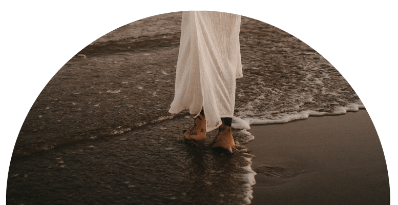 Become a Akasha Healer at New Earth Medicine Woman in a white dress walks at the beach - Become a Akasha Healer