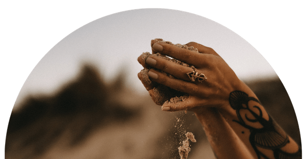 Golden Healer Curriculum - New Earth Medicine Hands hold sea sand and show the power of a healer