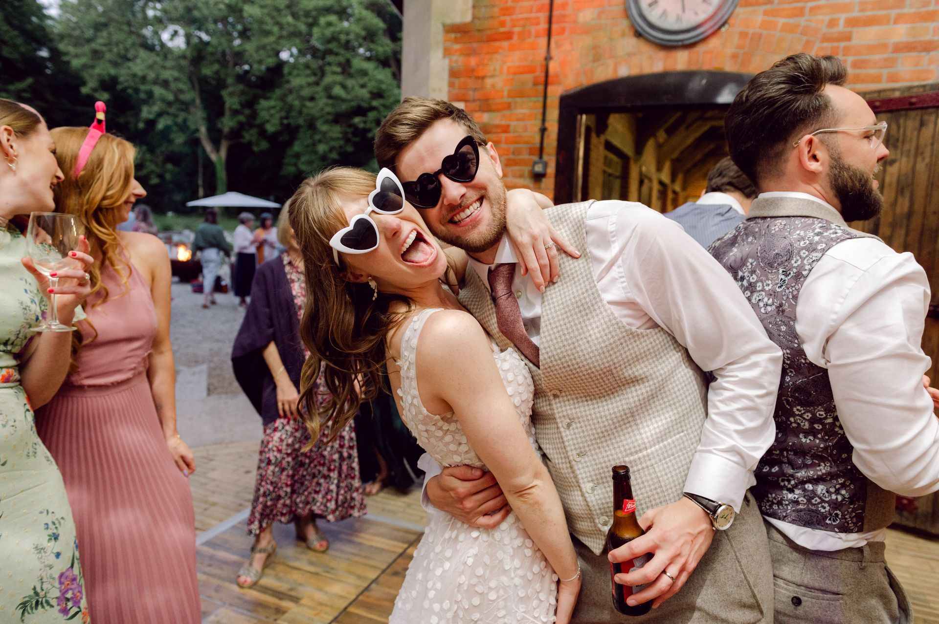 Bride and groom wearing funny sunglasses at Kingsettle Stud co-ordinated by Tasha Mae Wedding Co-ordinator.