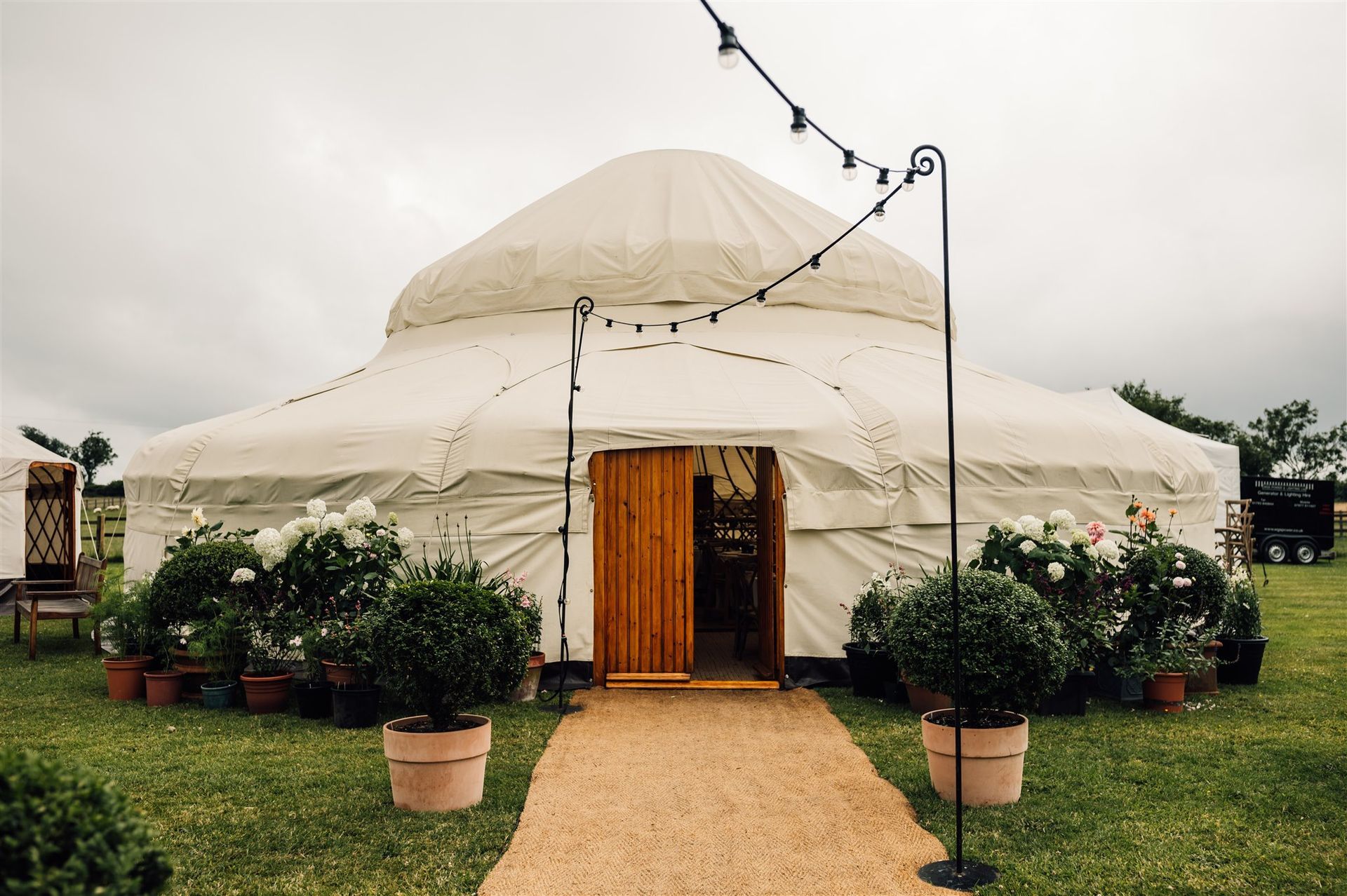 A yurt set up in a garden ready for a wedding co-ordinated by Tasha Mae Wedding Co-ordinator.