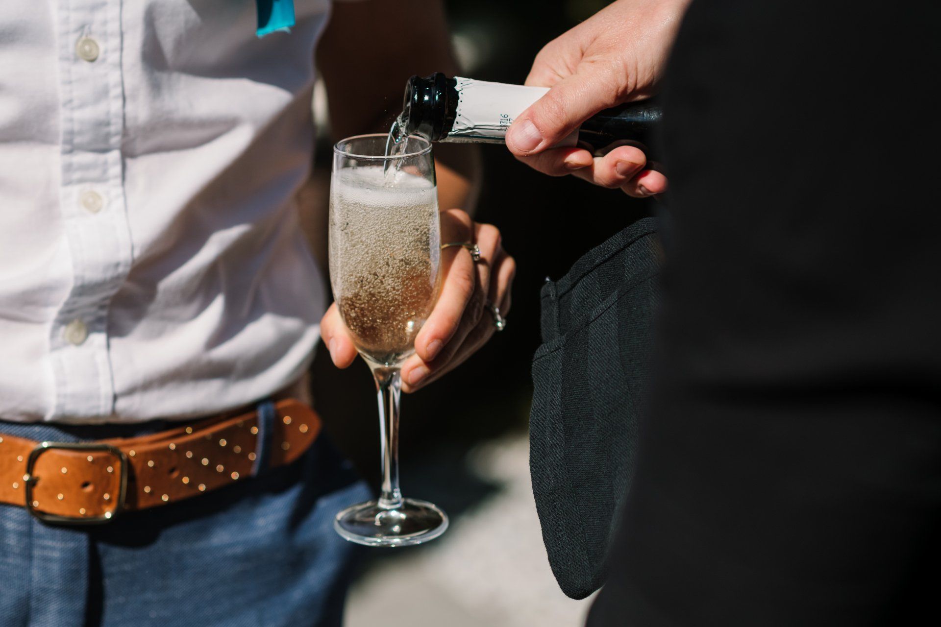 Pouring welcome drinks at a wedding