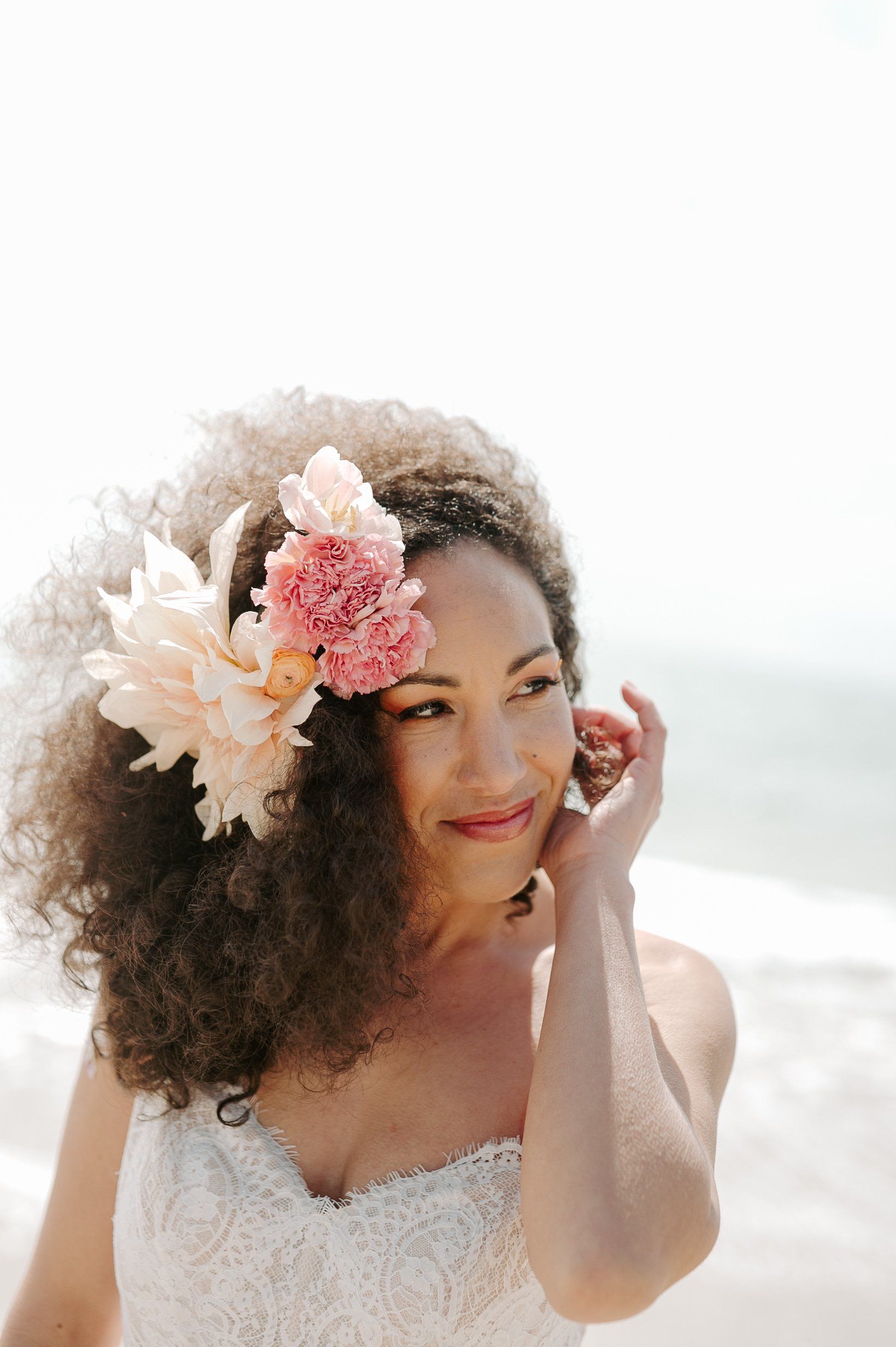 Close up of bridal hair with big blooms and bridal make-up