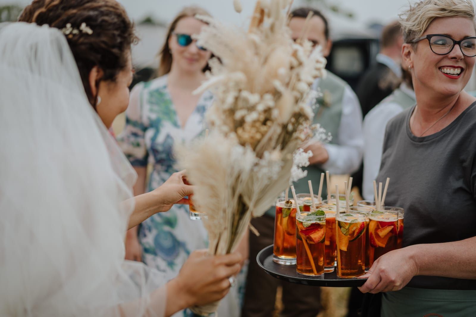 Tasha Mae wedding co-ordinator serving welcome drinks to a bride