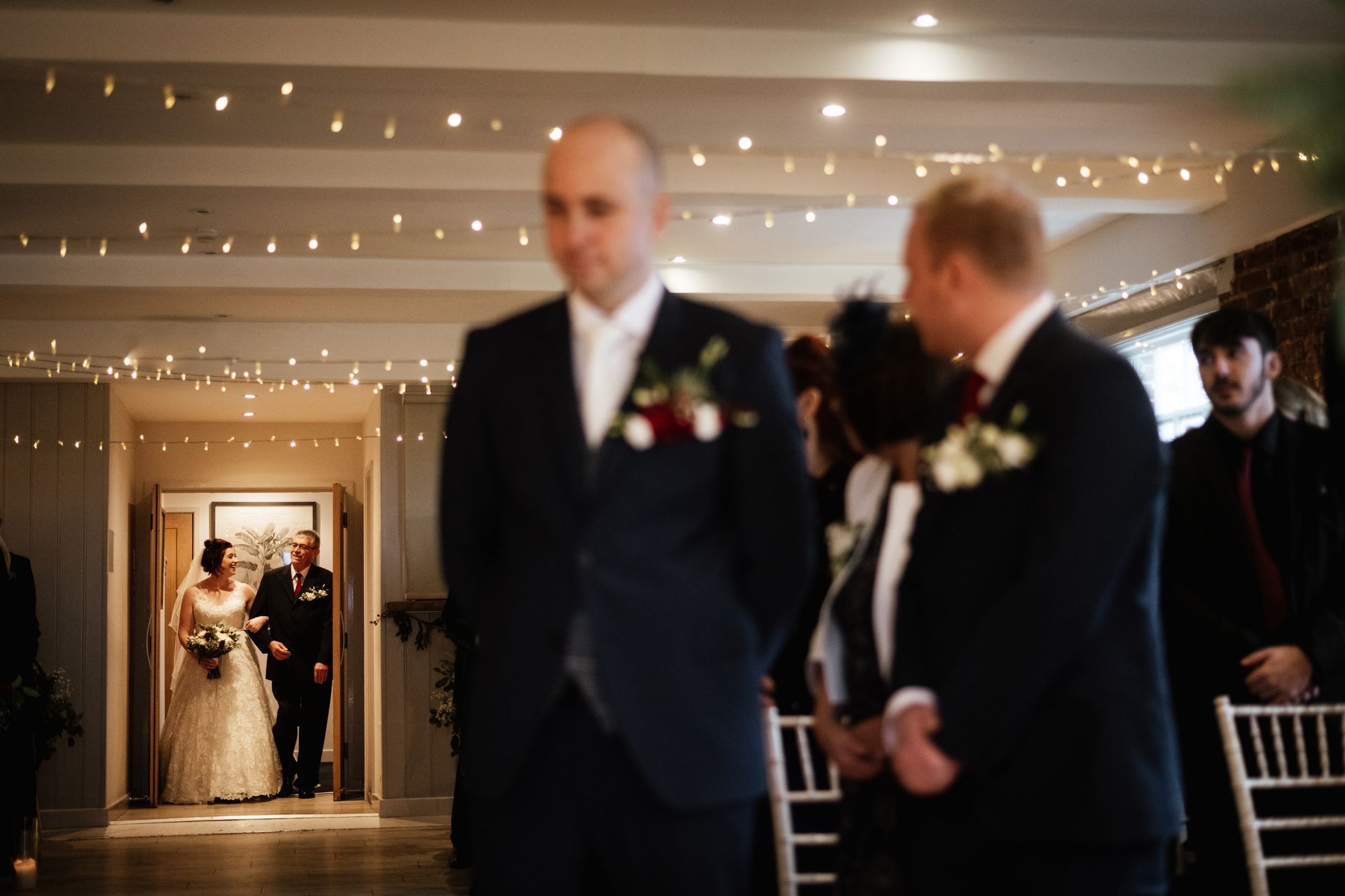 The bride and her dad walking through the ceremony room doors at a wedding at Sopley Mill with Tasha Mae Wedding Co-ordinator.