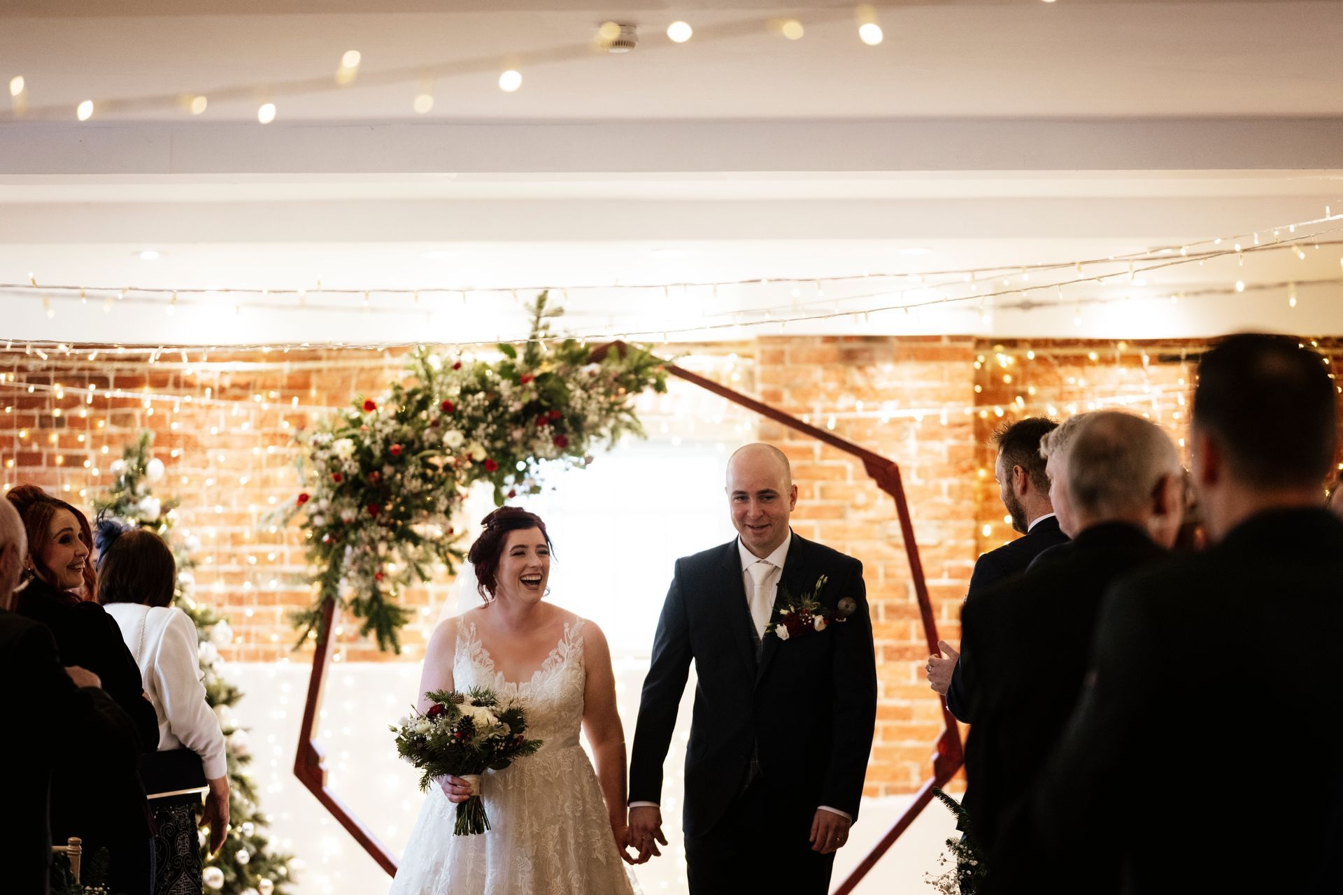 A bride and grrom walking back up the aisle after they have married at Sopley Mill with Tasha Mae Wedding Co-ordinator.